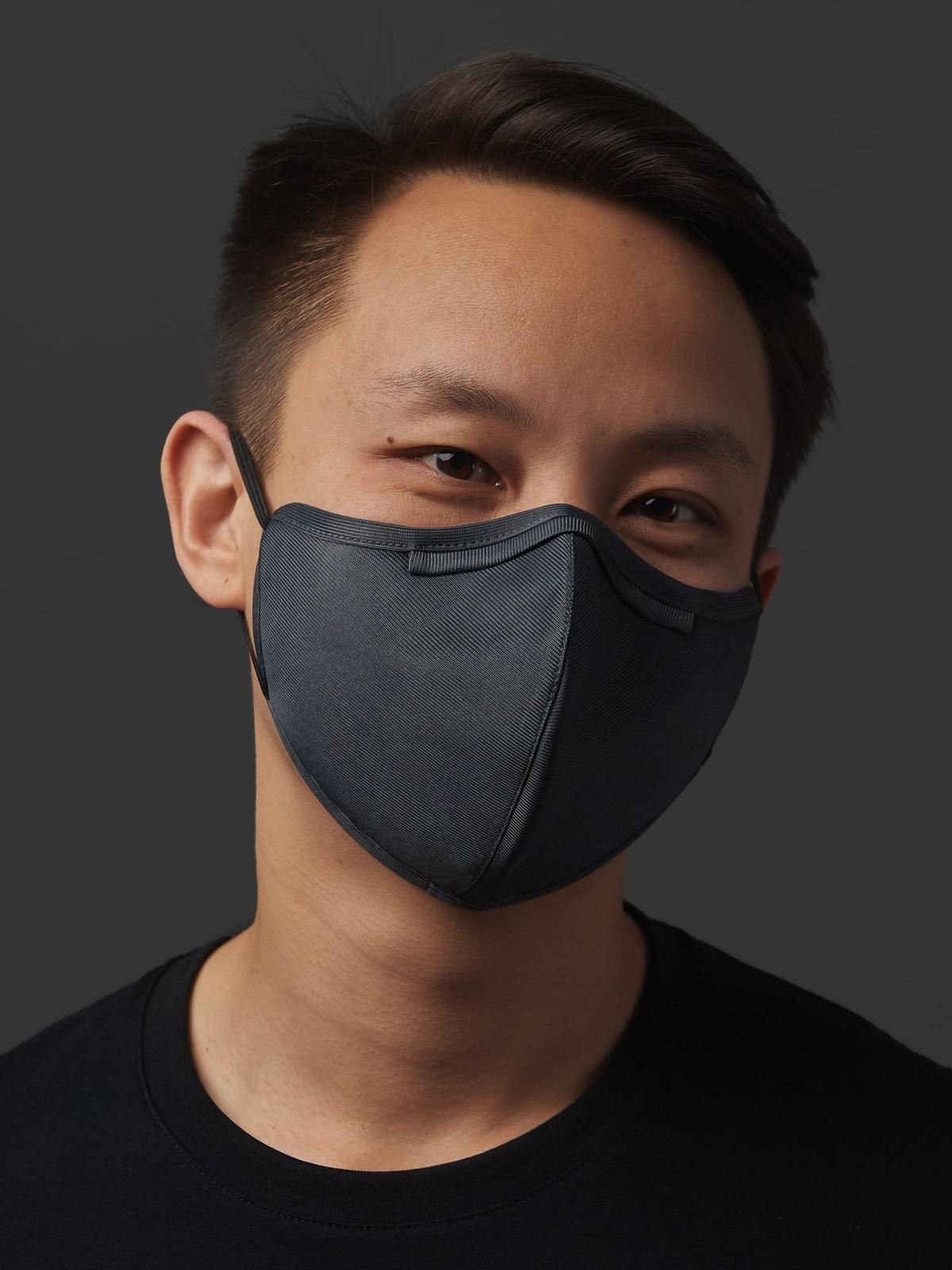 a model wears the gray VO mask