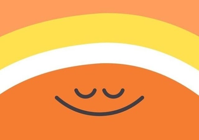 An illustration of an orange circle with a smiling face 