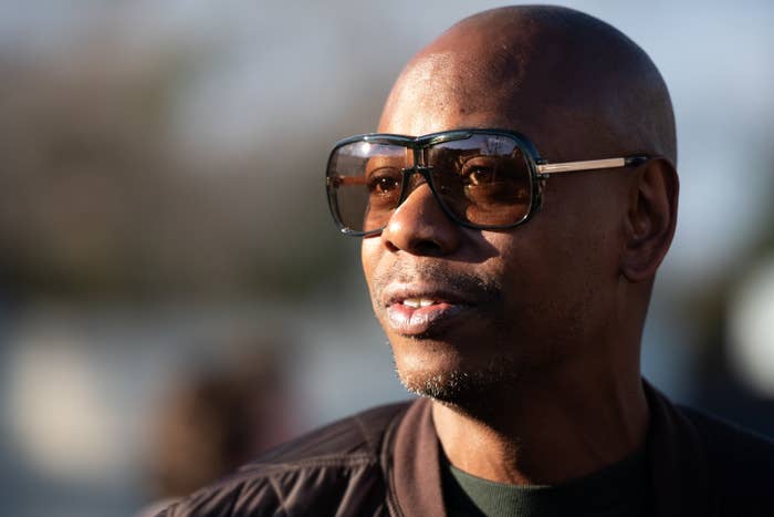 Comedian Dave Chappelle wears sunglasses as he campaigns for Democratic presidential candidate Andrew Yang 