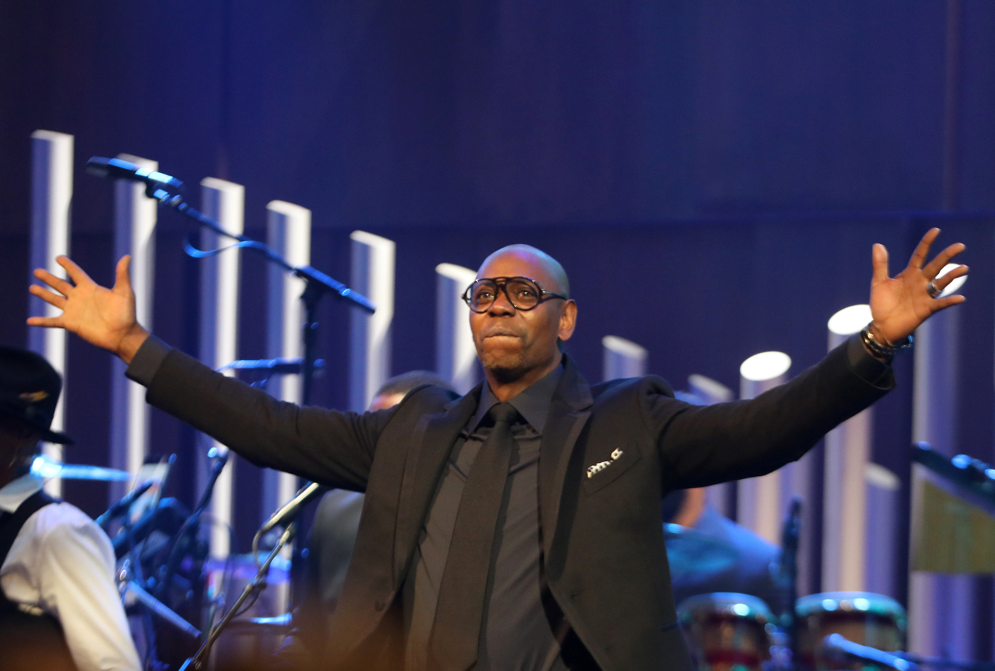  Dave Chappelle raises his arms during the Mark Twain award show at the Kennedy Center