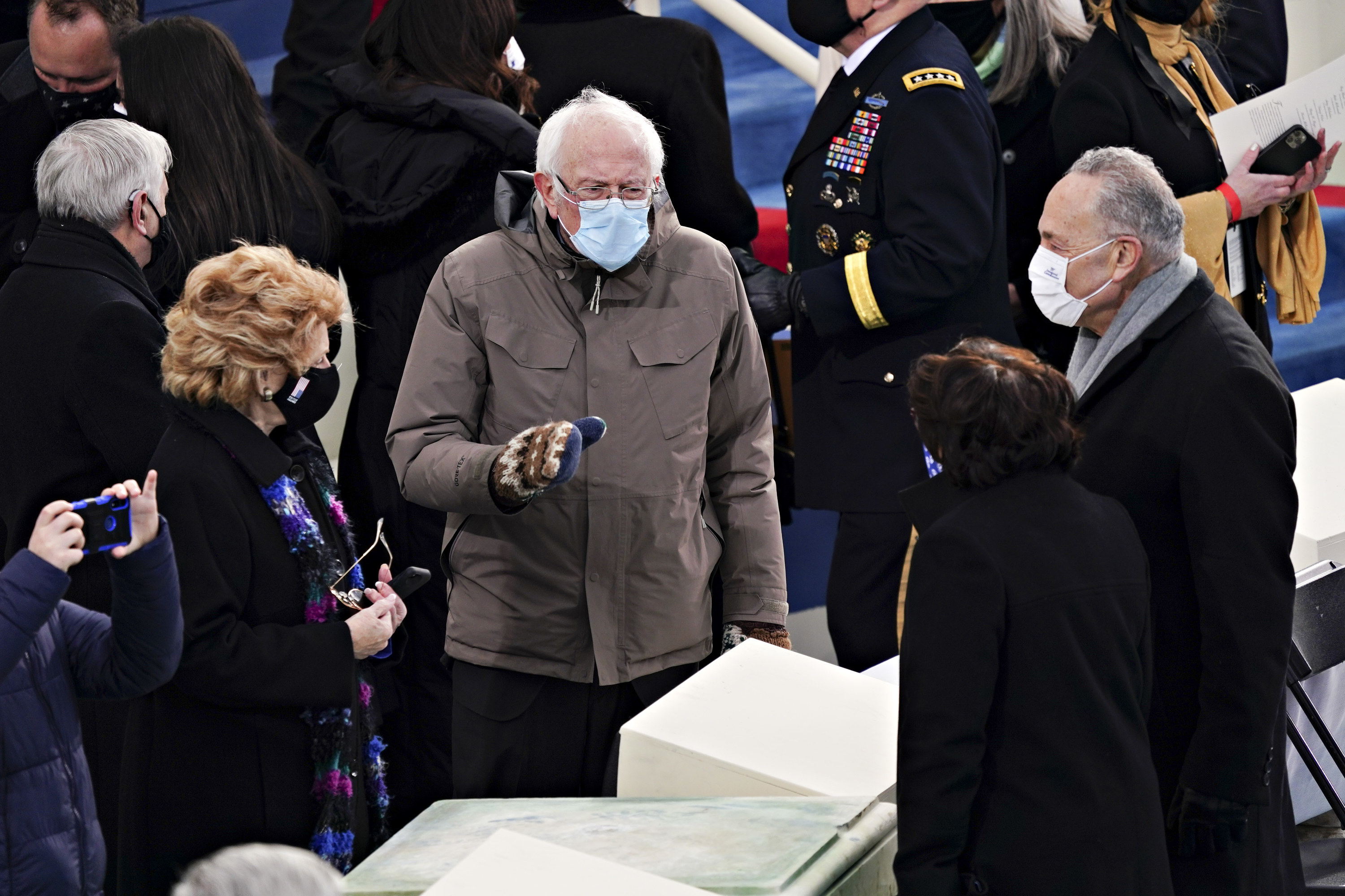 Senate Minority Leader Chuck Schumer, Senator Bernie Sanders, and Senator Debbie Stabenow speak during the inauguration ceremony on the West Front of the U.S. Capitol