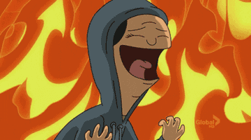 An animated person laughing around a wall of fire