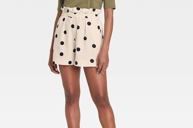 Model in high-rise paper bag shorts