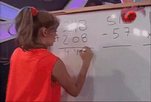 A GIF of a woman doing a math problem