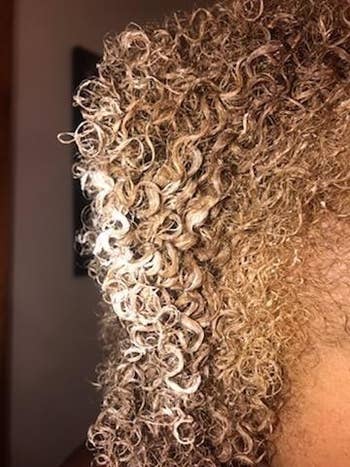 reviewer photo showing the tight curls in their hair 