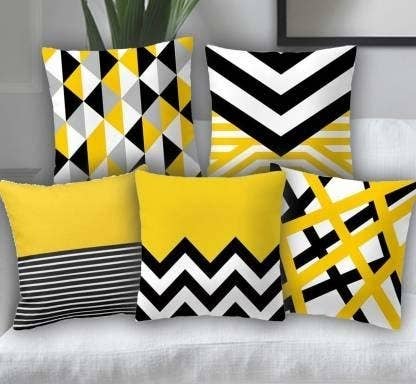 Yellow, black and white geometric pillows.