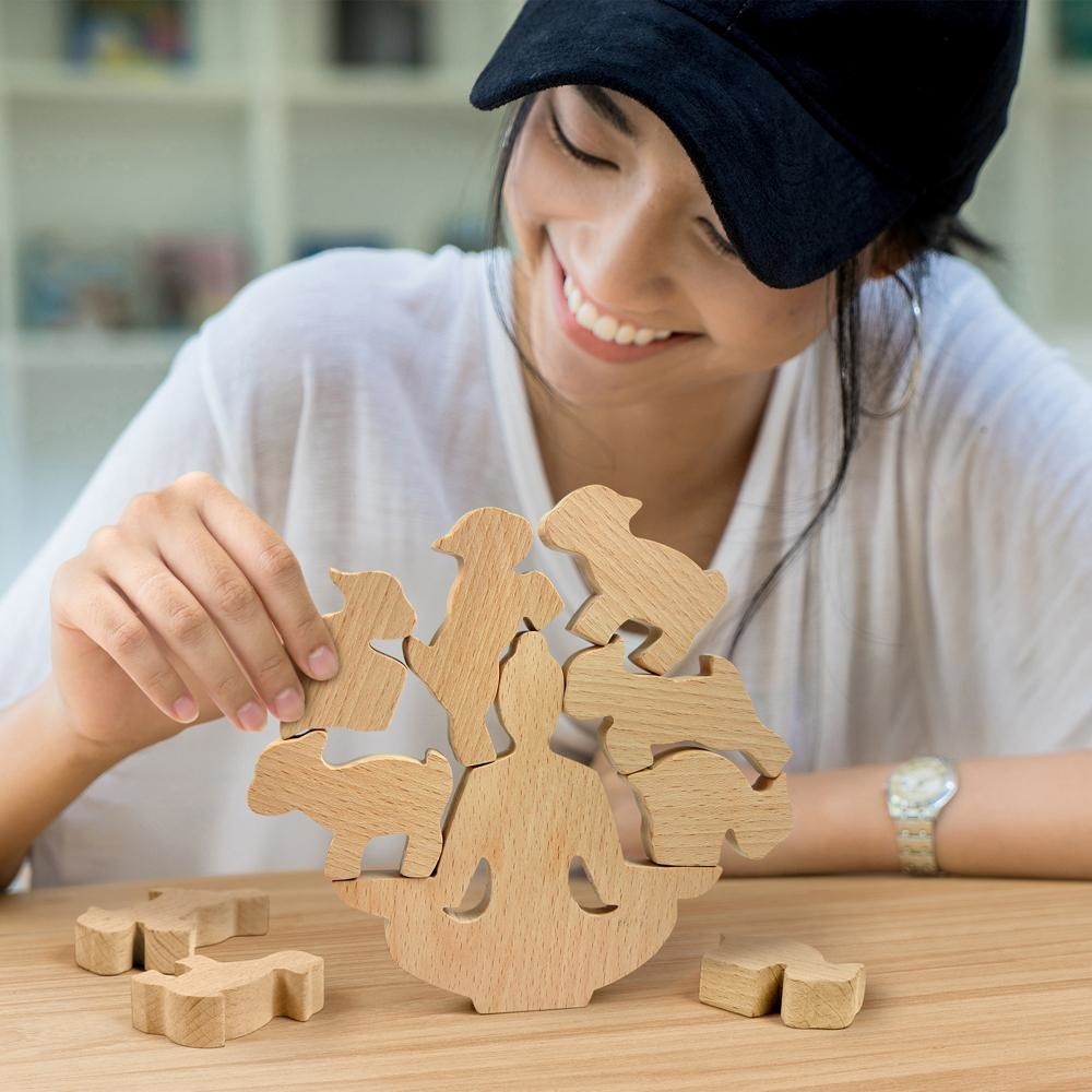 A person playing the goat-stacking game