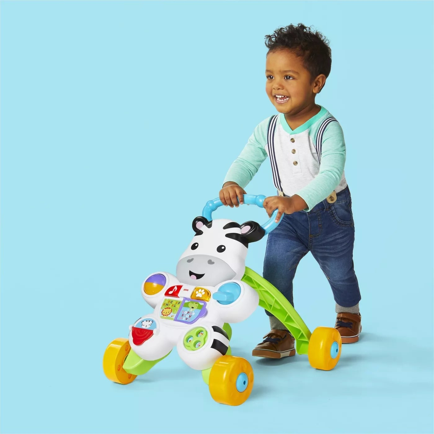 A toddler using the zebra walker