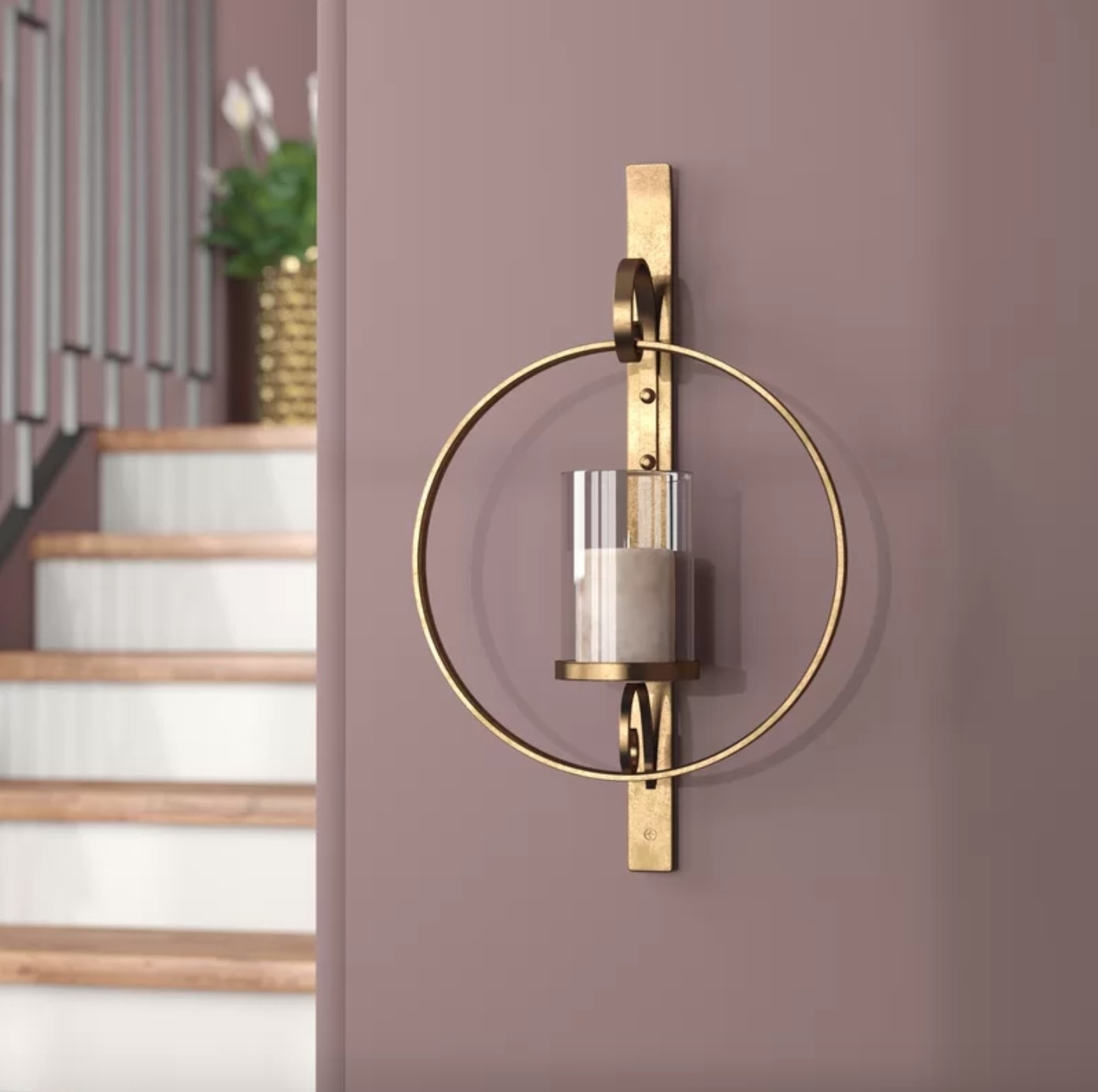 The wall sconce in gold