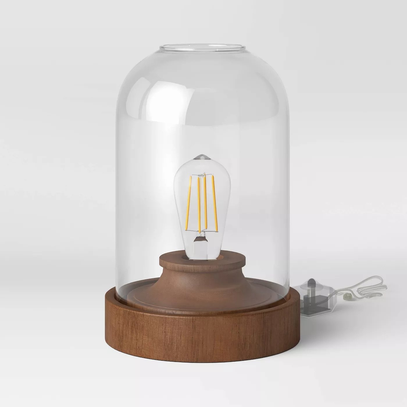 The brown-based lamp with a glass dome top