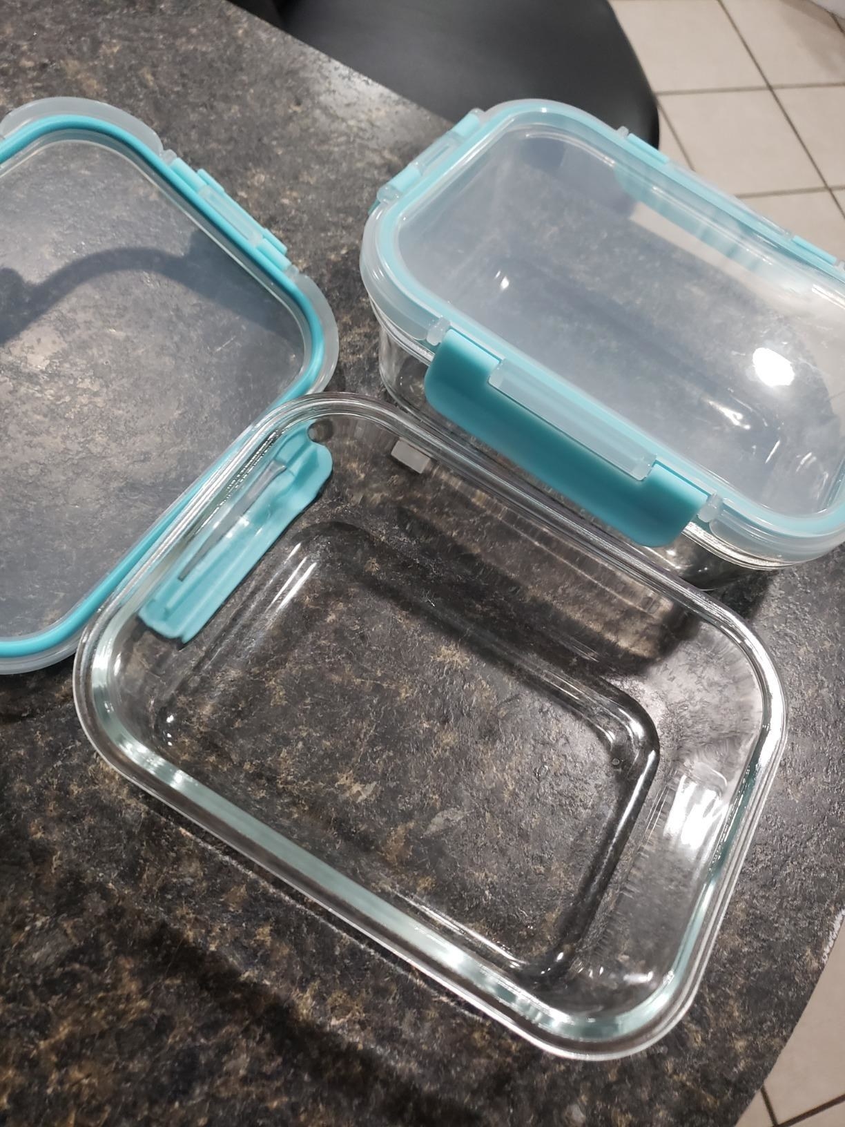 reviewer image of two light green Glass Meal Prep Containers on a kitchen counter