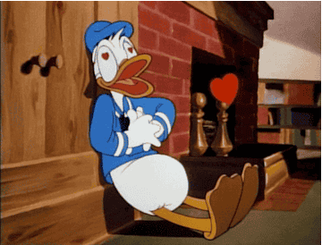 gif of Donald Duck with hearts in his eyes pumping his chest with hearts coming out of it