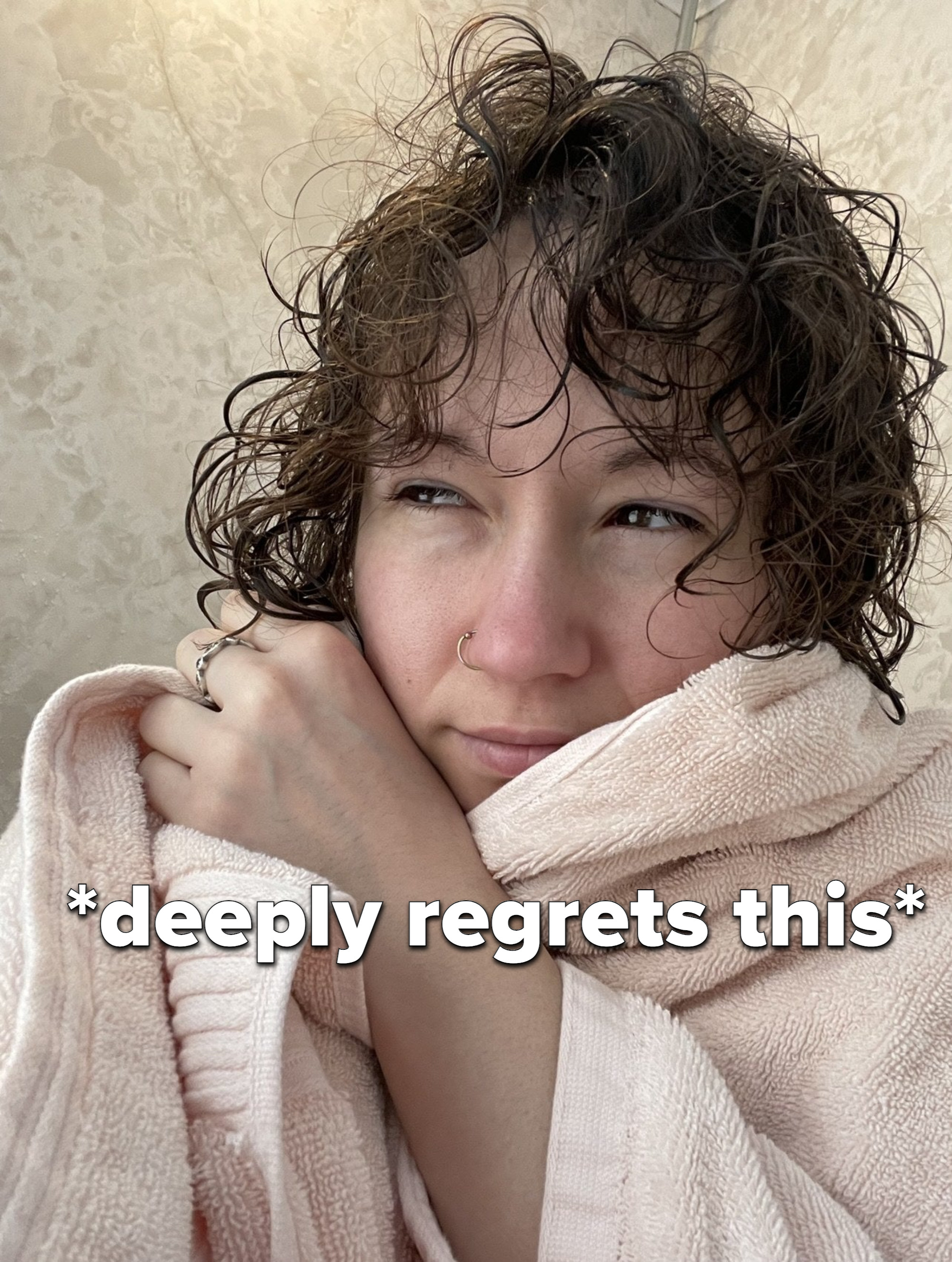 A person in a pink towel