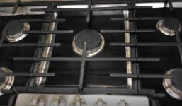 reviewer pic of stovetop with black liners subtly used