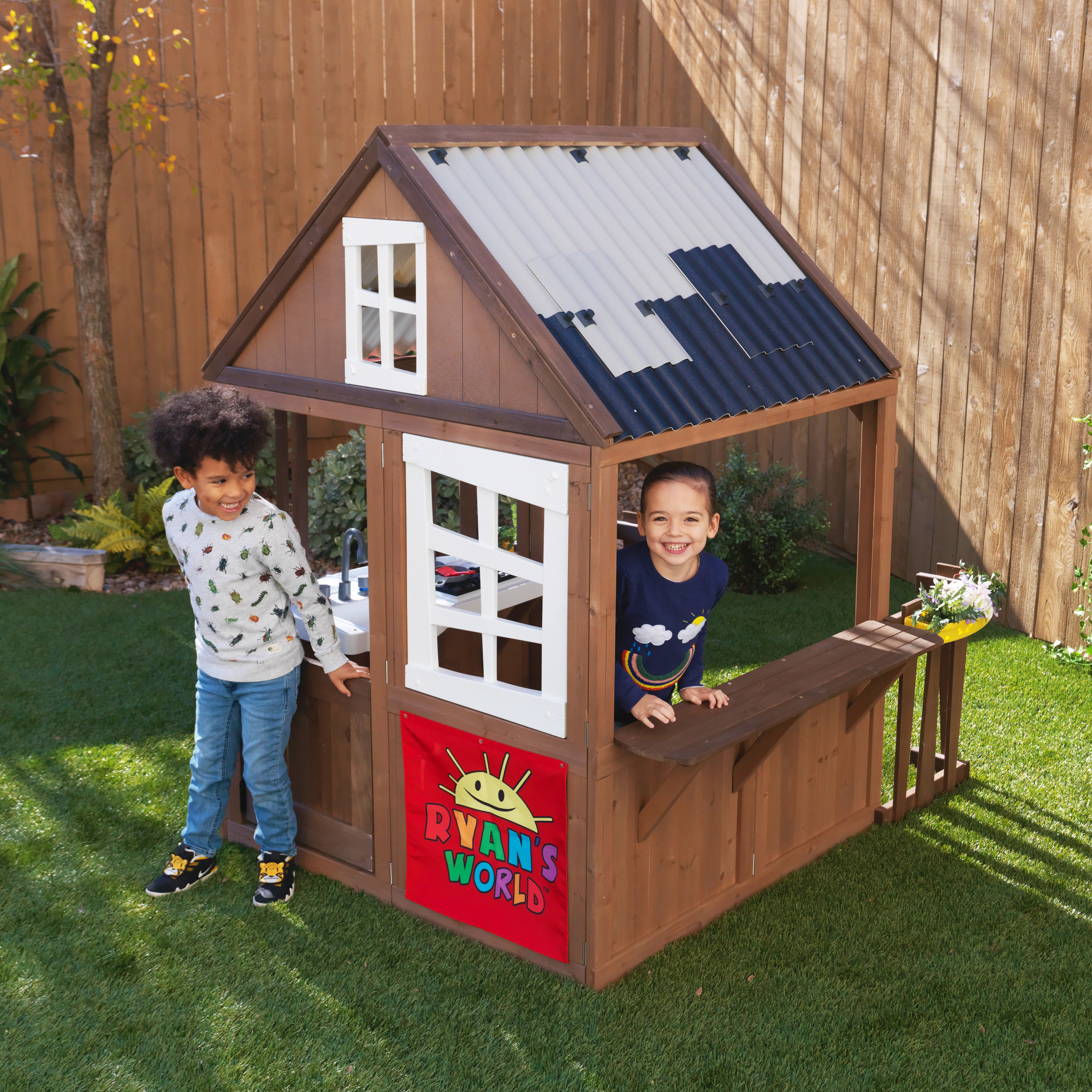 Two children playing in the playhouse