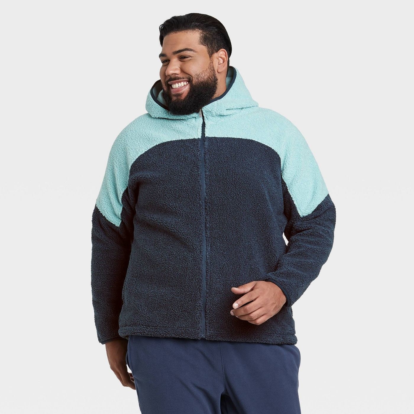 Model wearing the colorblocked fleece zip up hoodie