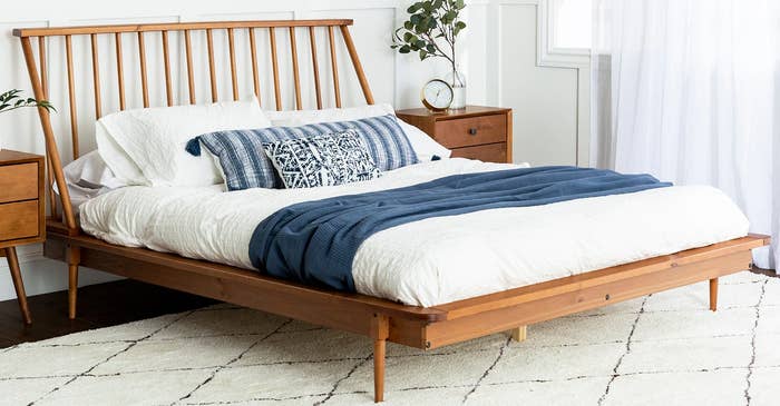 A bed frame in a bedroom. 