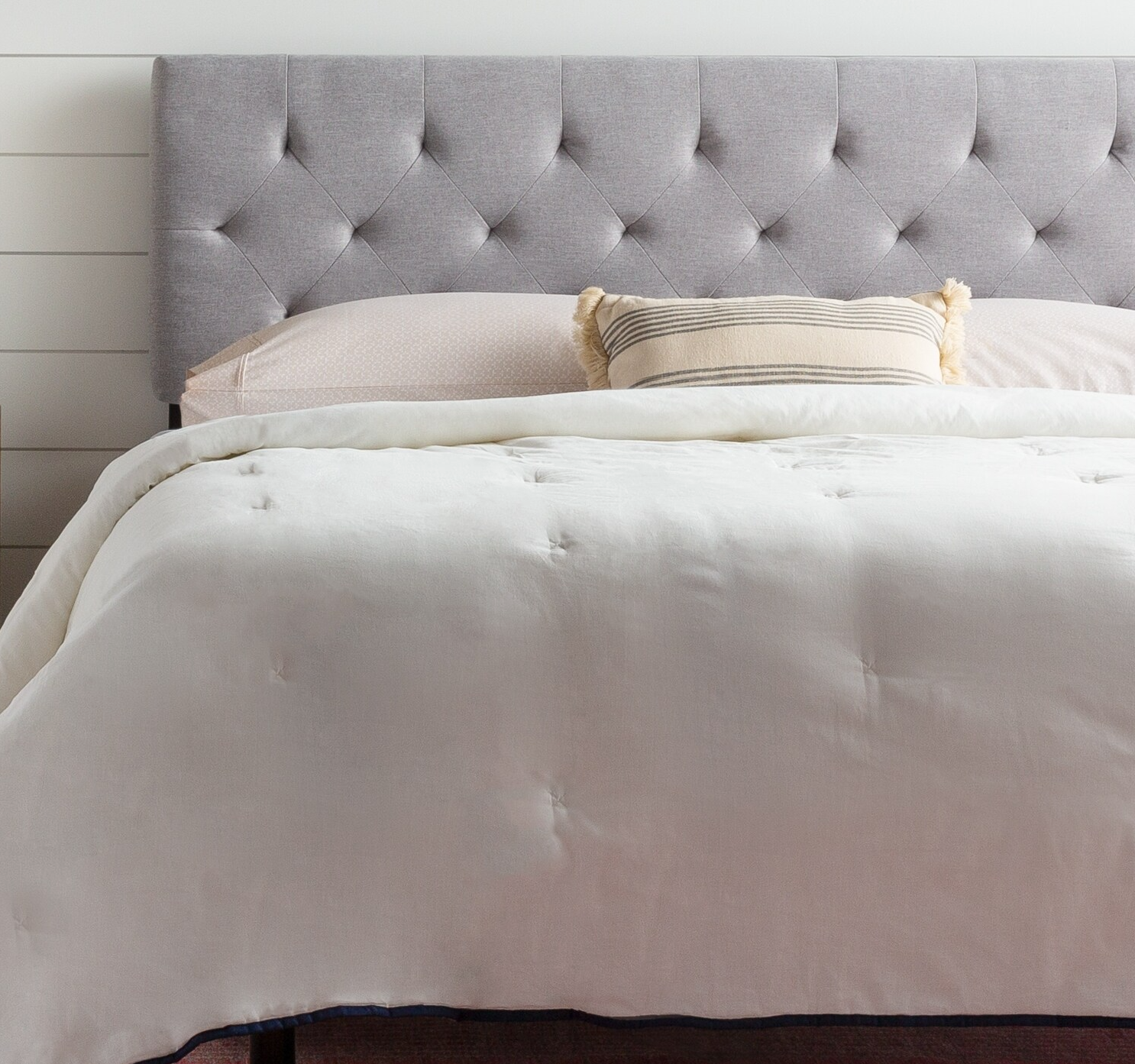 A headboard on top of a bed.