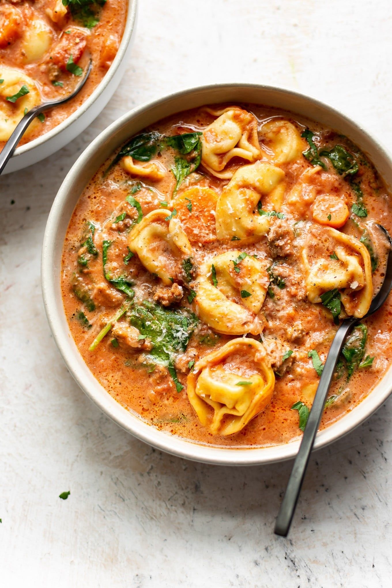 Crockpot tortellini soup with sausage in a bowl