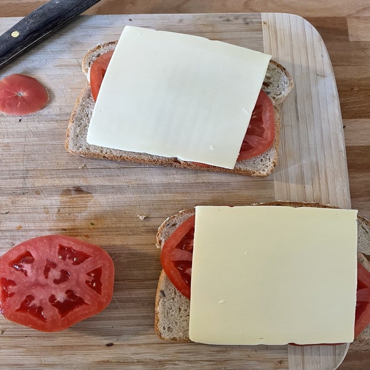 Toast with cheese and tomato on top