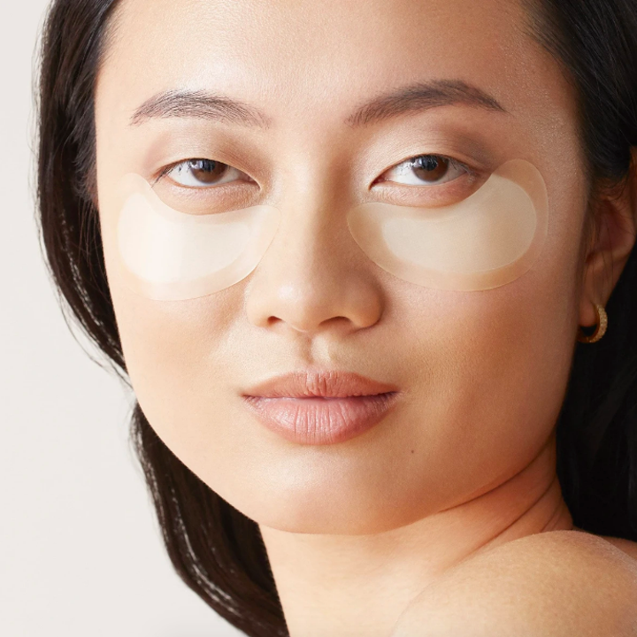 Person wearing patches under their eyes 