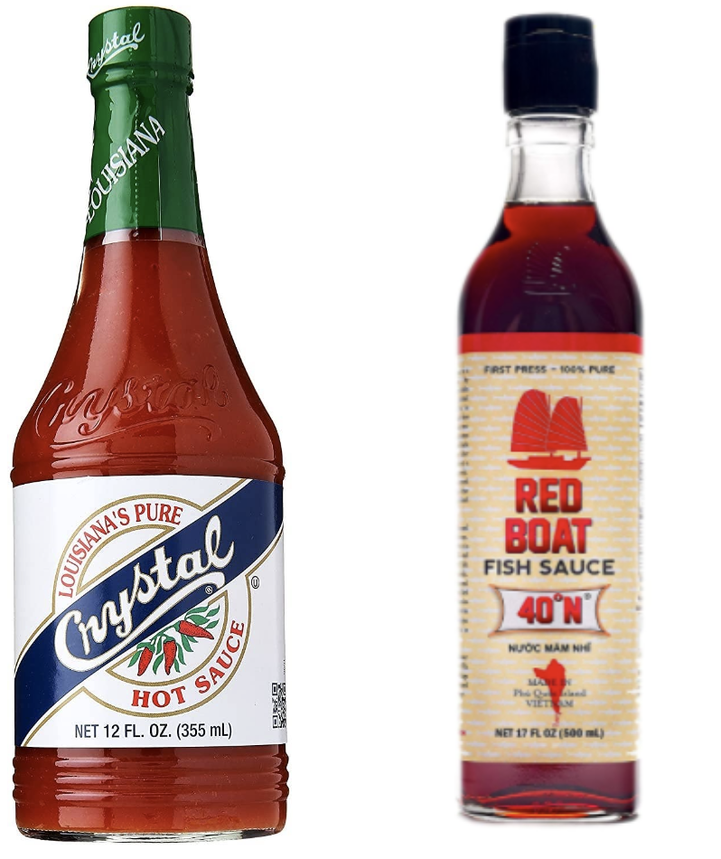 A bottle of Crystal hot sauce next to a bottle of Red Boat fish sauce