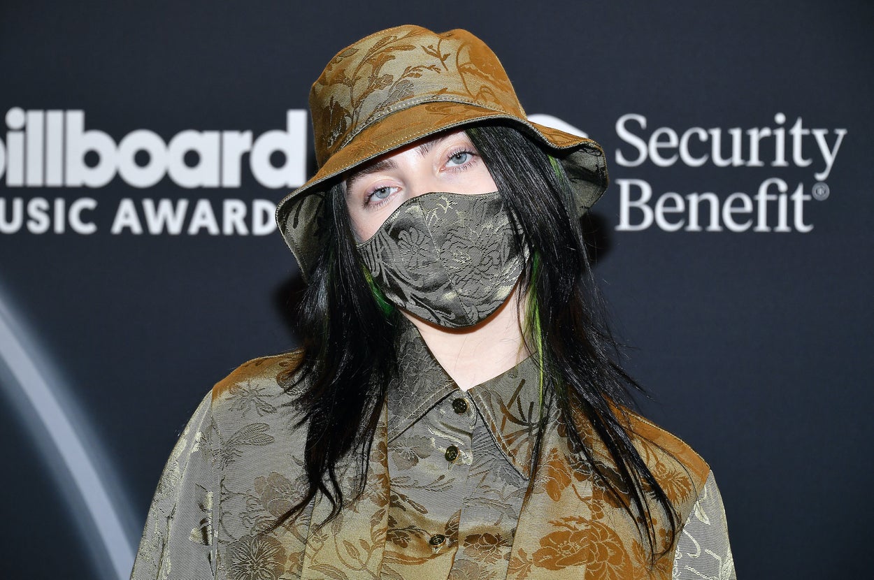 Billie Eilish wearing a bucket hat, face mask, and button-down shirt at the 2020 Billboard Music Awards
