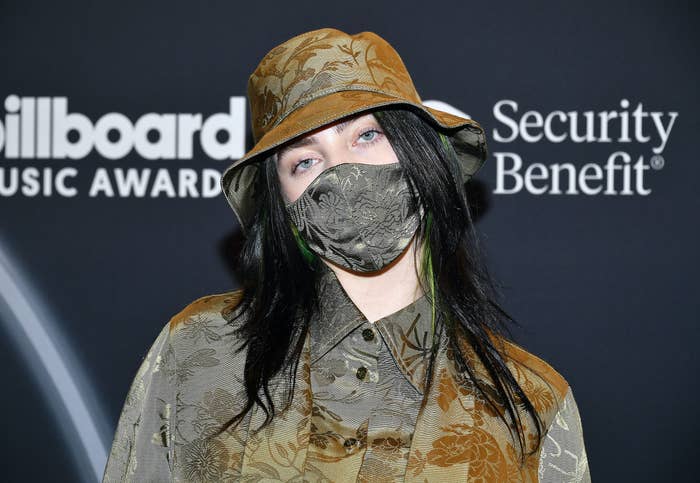 Billie Eilish wearing a bucket hat, face mask, and button-down shirt at the 2020 Billboard Music Awards