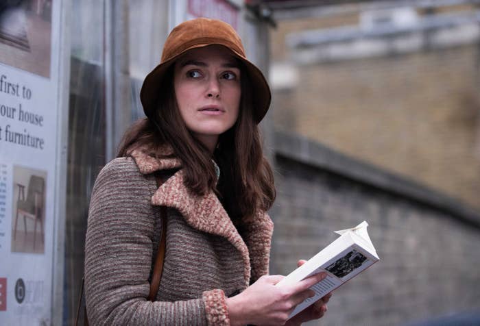 Keira Knightley reads a book in a still from the film Misbehavior