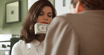Bridget licking money in The Last Seduction