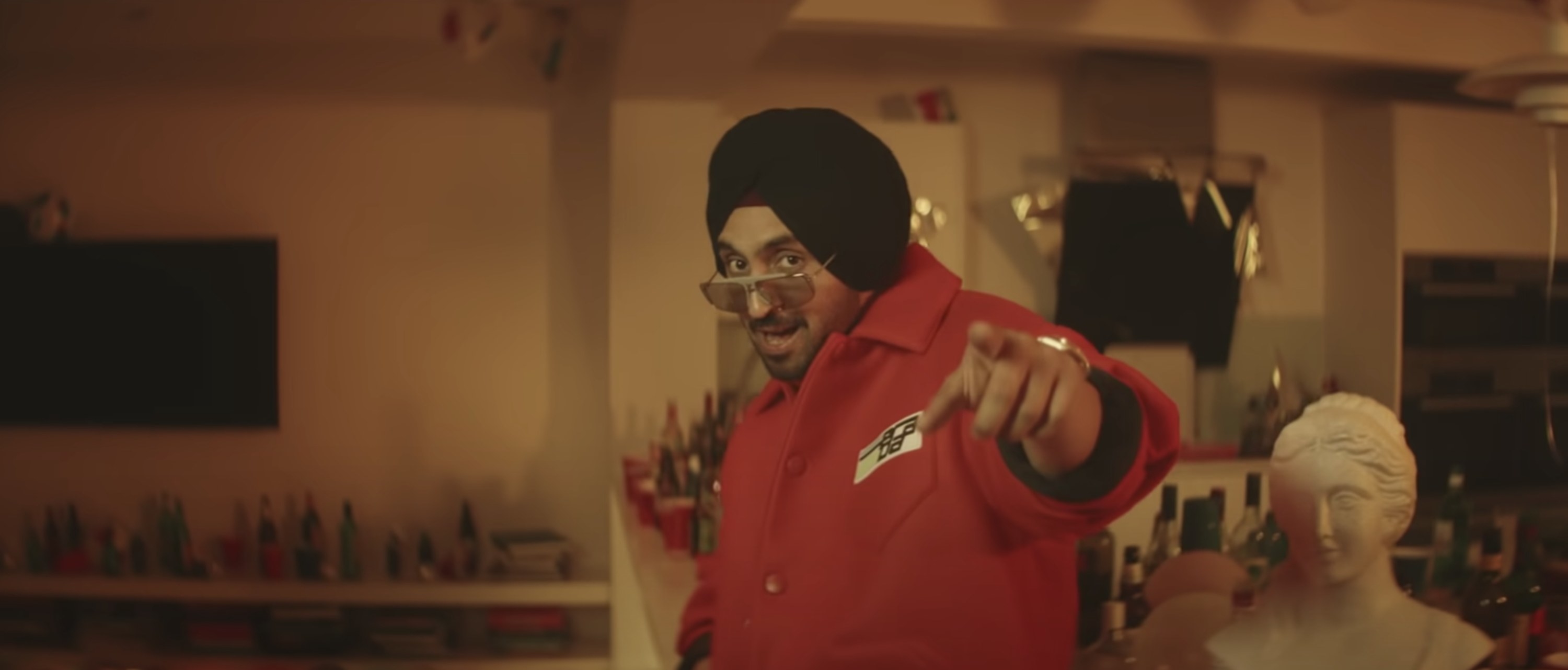 Diljit Dosanjh singing in the &quot;Jind Mahi&quot; music video.