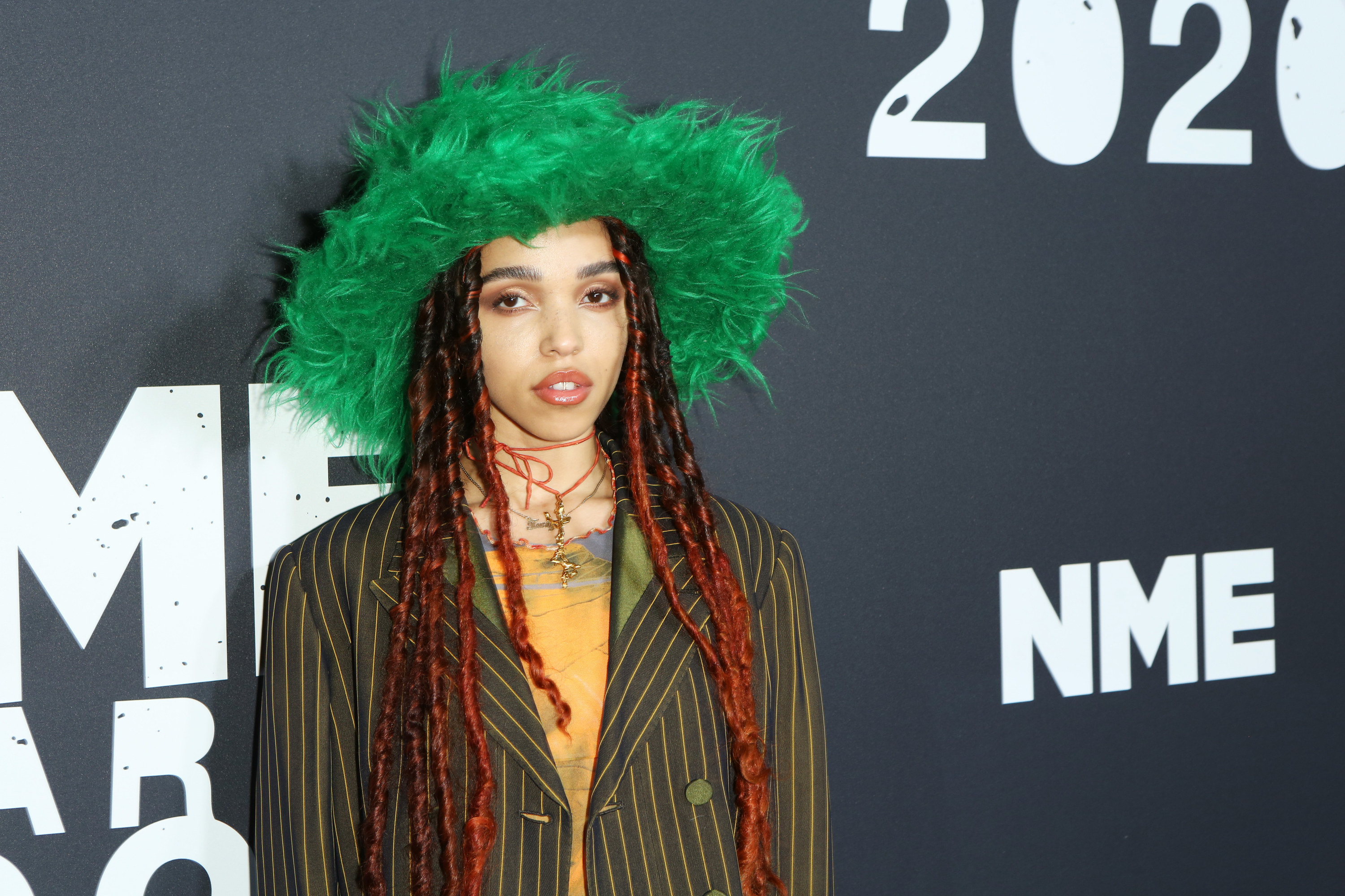 FKA Twigs attends The NME Awards 2020 wearing a wide-brimmed fuzzy hat and a blazer