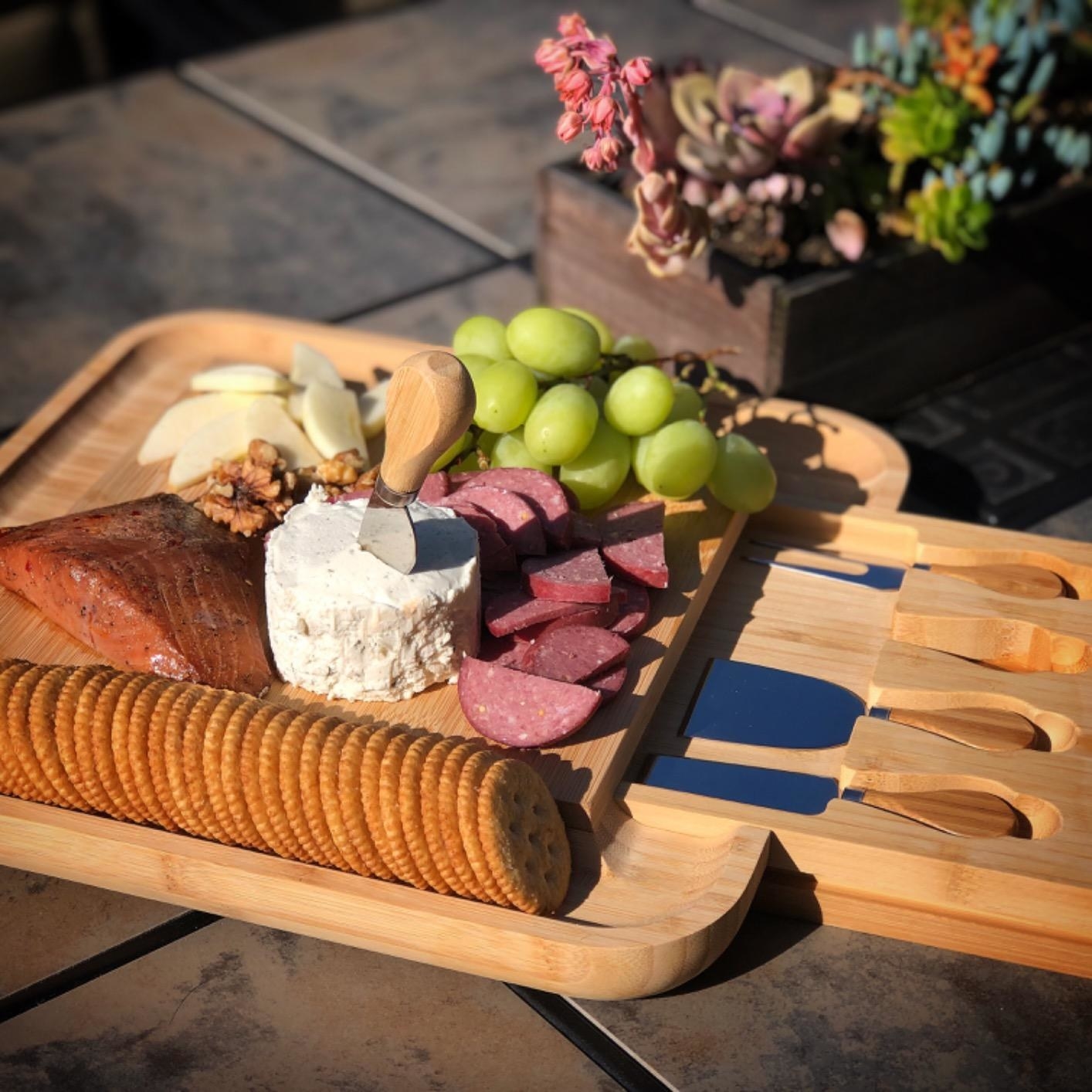 Reviewer photo of meats, cheeses, fruits and crackers placed on charcuterie board
