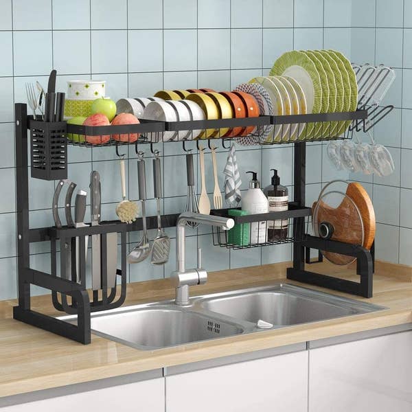 The black over-the-sink rack placed above a two-basin sink