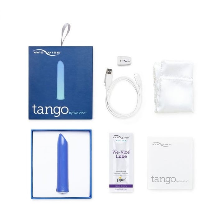 The blue version in its packaging with the charger cord, pouch, and lube