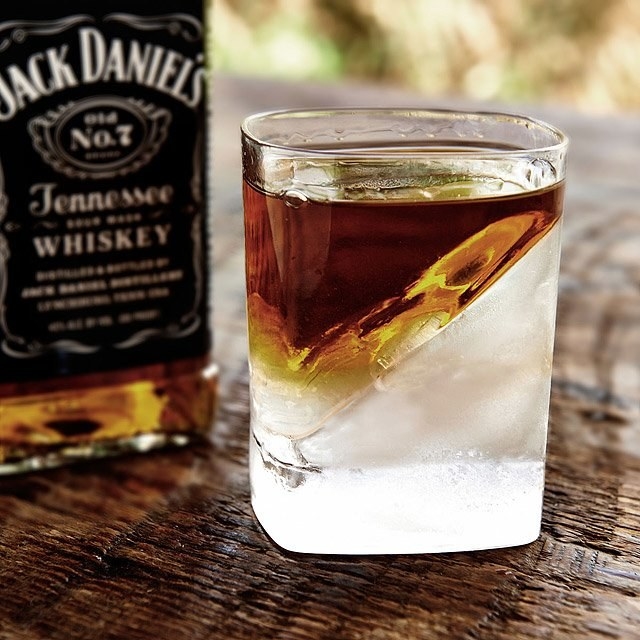 Clear glass with ice and whisky