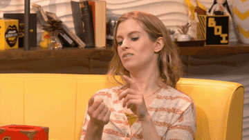 A gif of Barbara Dunkelman saying add to cart while miming online shopping