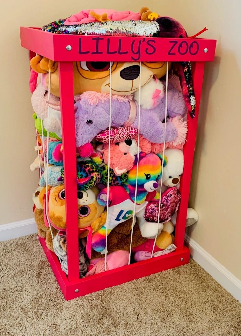 A pink stuffed animal zoo customized with &quot;Lilly&#x27;s zoo&quot;  