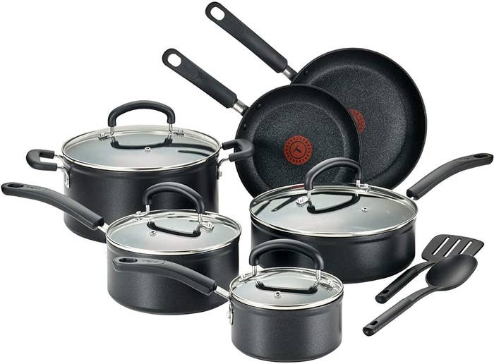 Three different-sizes pots, two different-sized skillets, a dutch oven, a spatula, and a spoon 