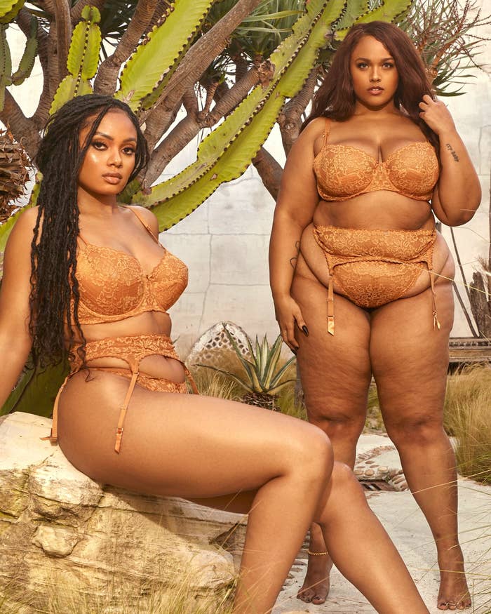 two models in honey colored lace bras, a garter, and thongs