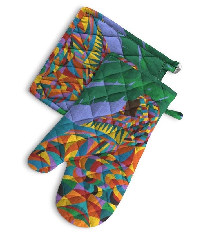A quiltedven mitt and potholder printed with a bright multicolor motif 