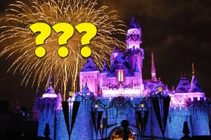 Sleeping Beauty Castle at Disneyland with fireworks and question marks