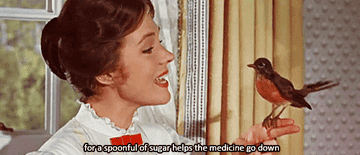 A GIF of Mary Poppins singing &quot;for a spoonful of sugar helps the medicine go down&quot; with a bird on her finger