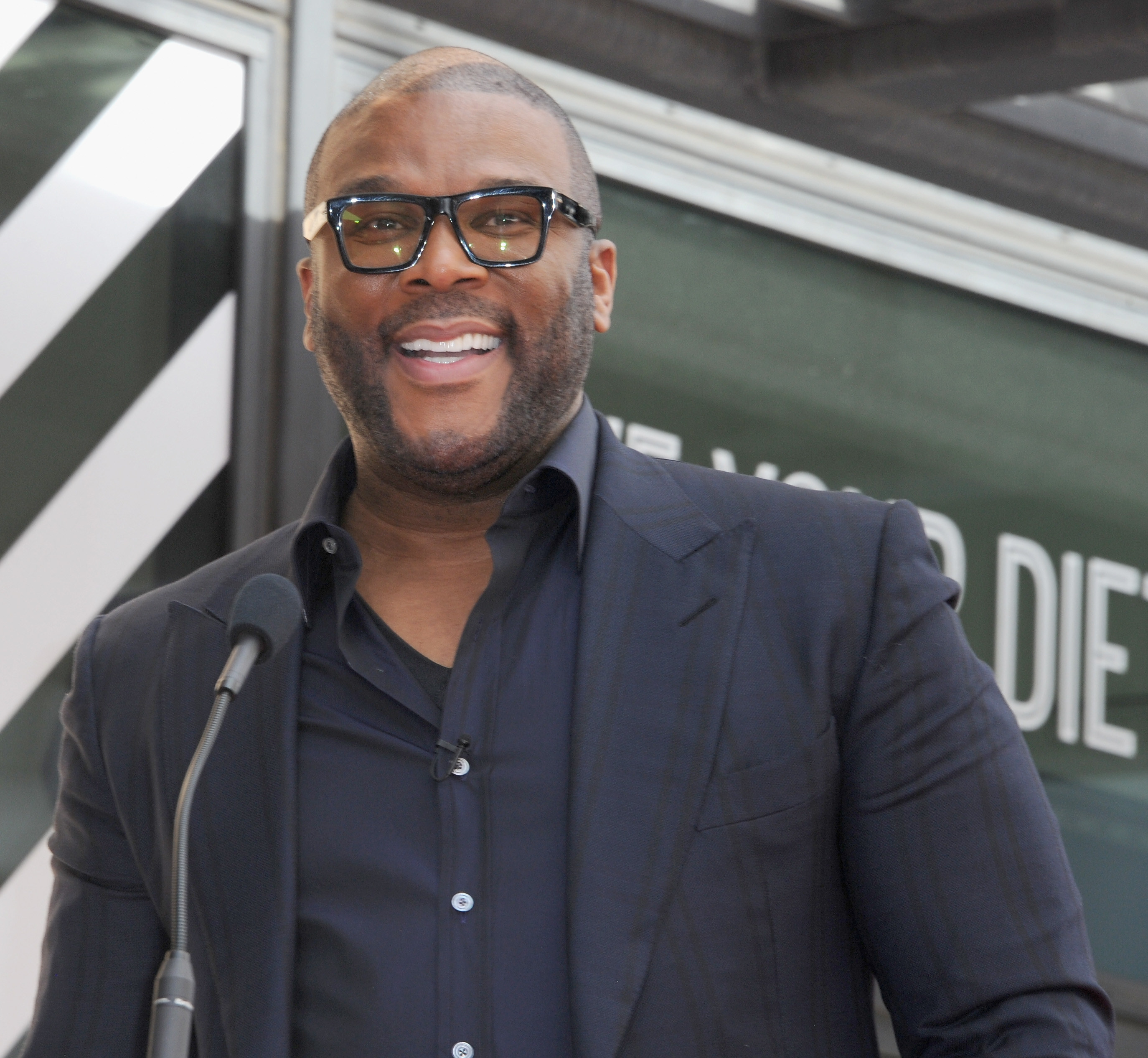 Tyler Perry smiling as he speaks at the Dr. Phil McGraw Star Ceremony On The Hollywood Walk Of Fame