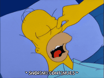 Homer Simpson snores while Marge tries to hold his mouth shut