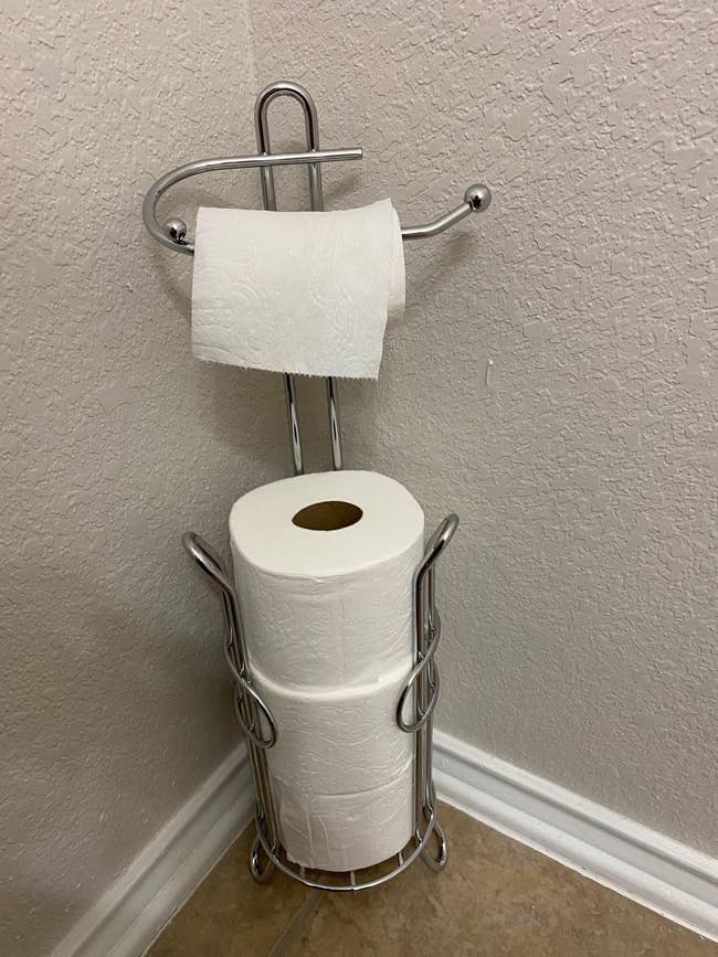 reviewer image of toilet paper stacked in the chrome SunnyPoint Bathroom Toilet paper holder