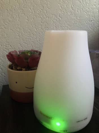 Reviewer image of small white diffuser on desk 