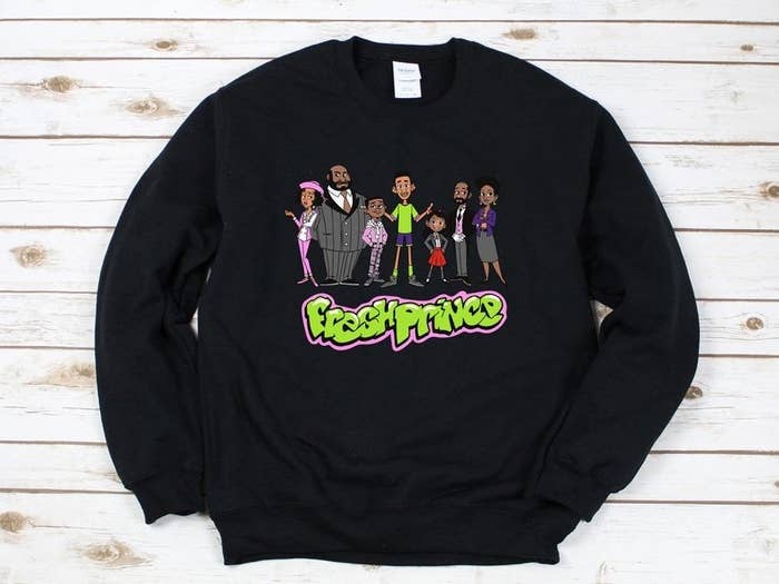 the black sweatshirt with the Fresh Prince cast as cartoons on it and the Fresh Prince logo 