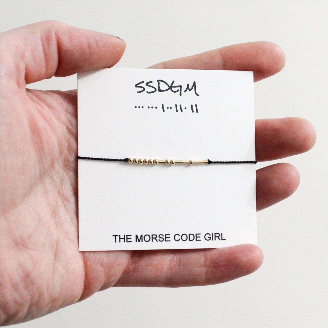 The SSDGM bracelet on its card