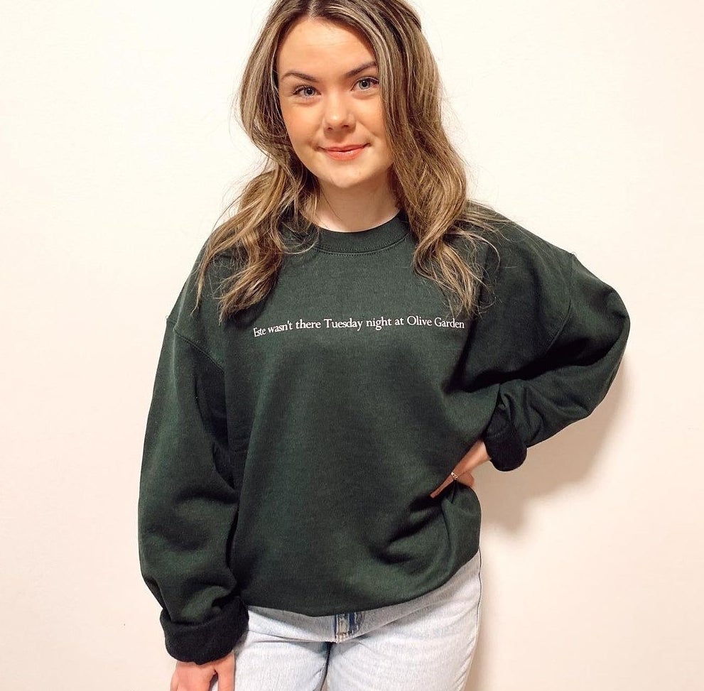 A person wearing the crewneck